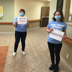 Staff holding happy messages