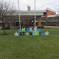 Another angle of the Heros at work sign